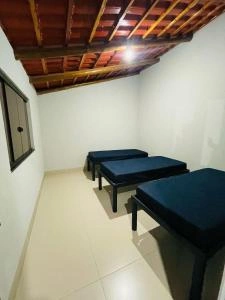 Simple Bedroom with Wooden Ceiling & Twin Beds